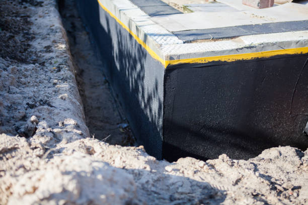 Professional Interior Drainage System technician working in Dunkirk, MD